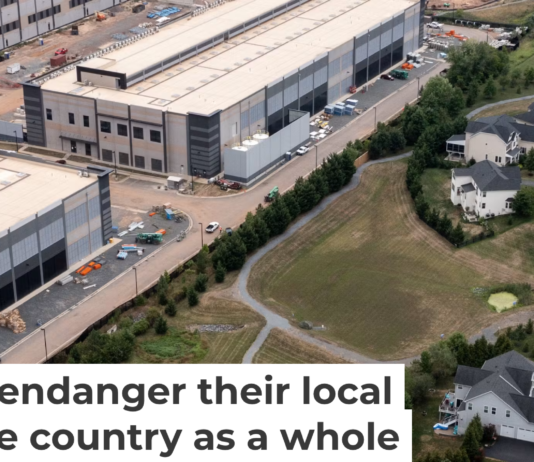 An Amazon data center sits next to a neighborhood in northern Virginia. Nathan Howard/Getty Images